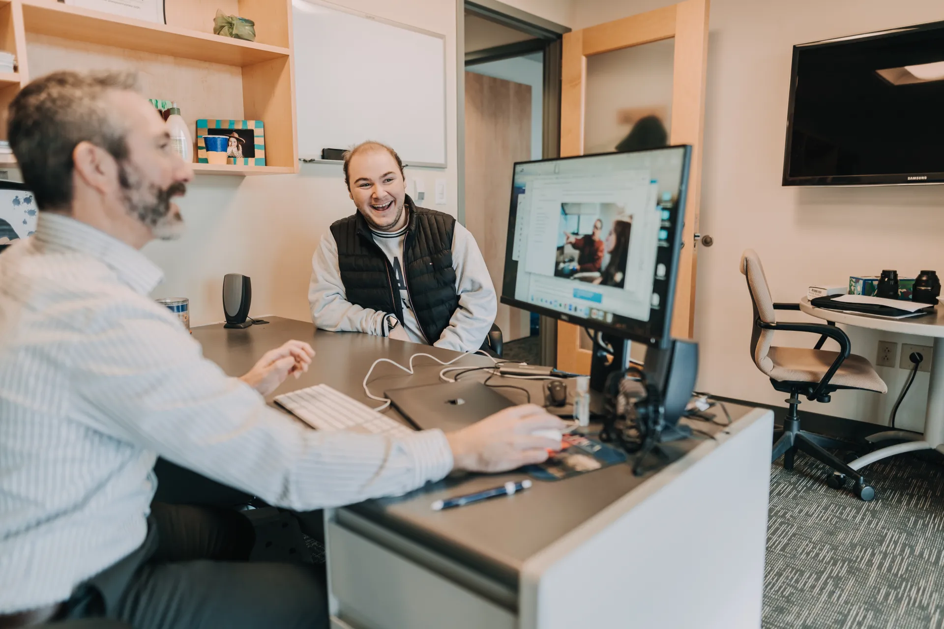 Student supervisor and student employee working together.