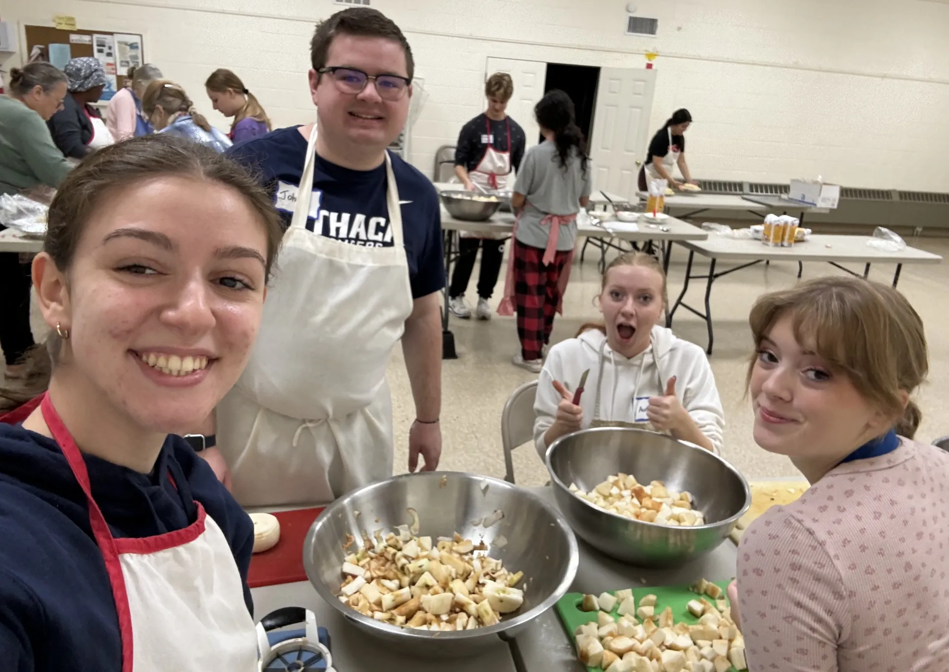 Photo of students chopping apples.