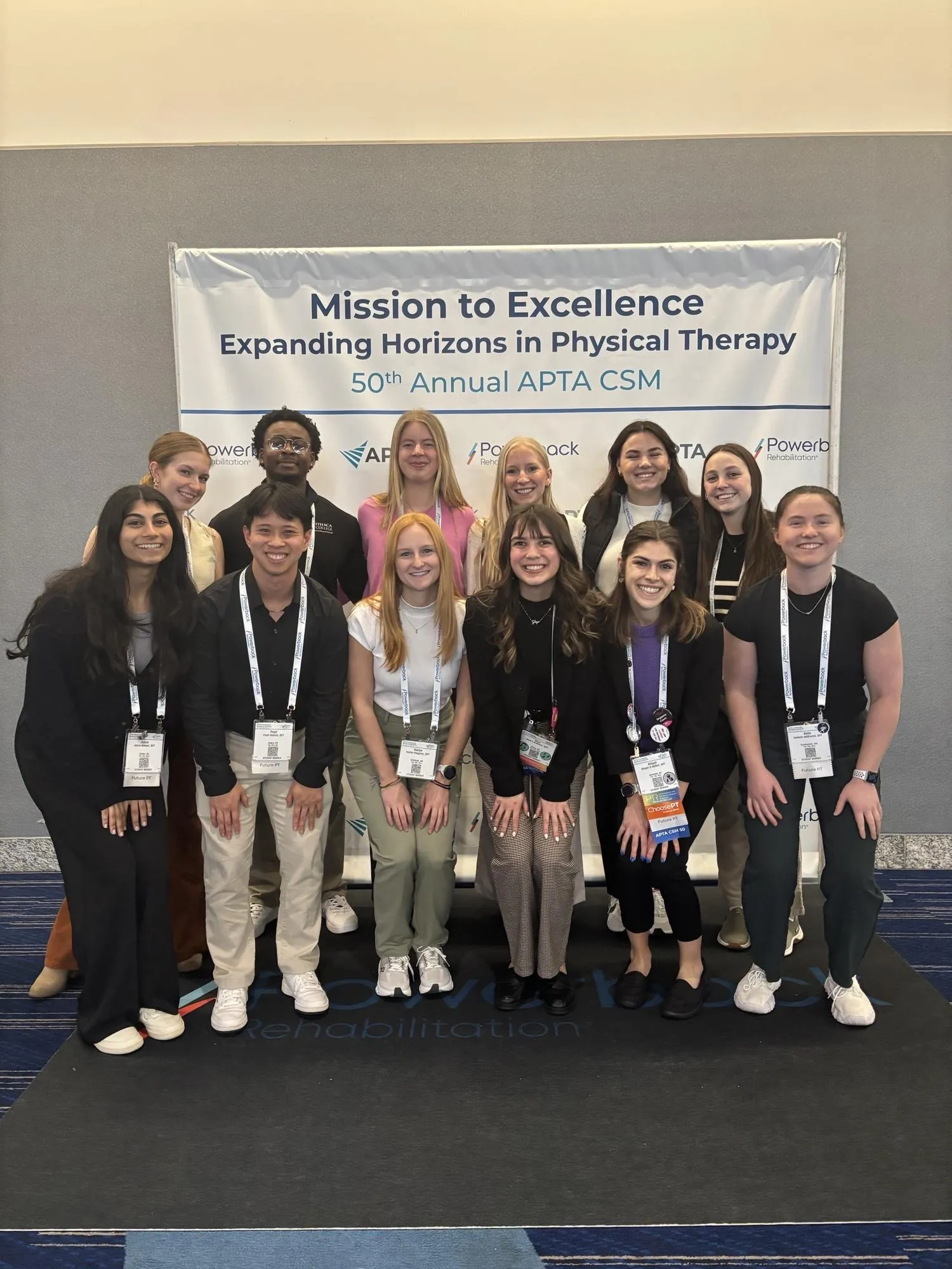 DPT students in front of APTA logo