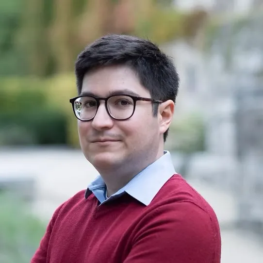 Picture of Dr. Zellner standing outside in a red sweater