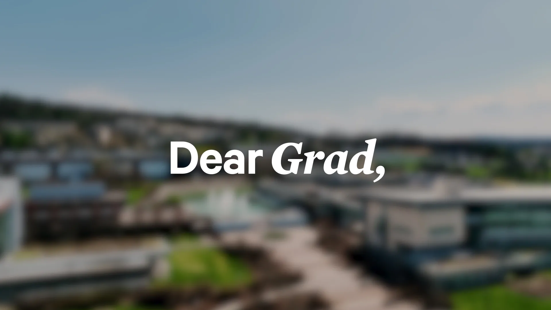 Blurred photo of Campus with Dear Grad written on it