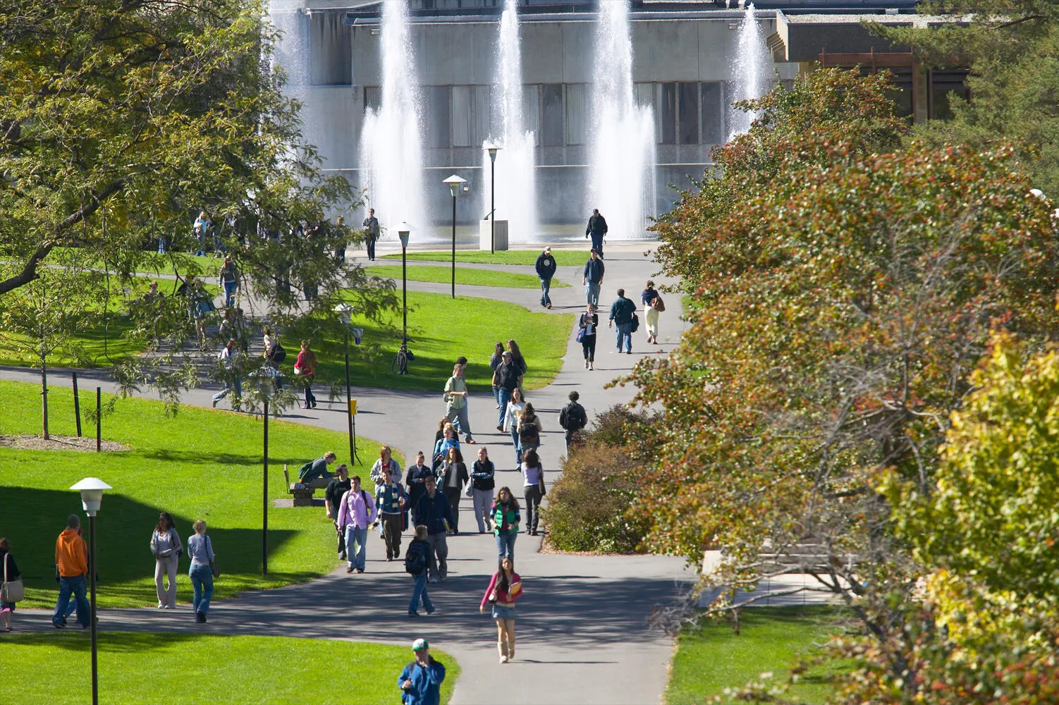 students walking on quad with fountains