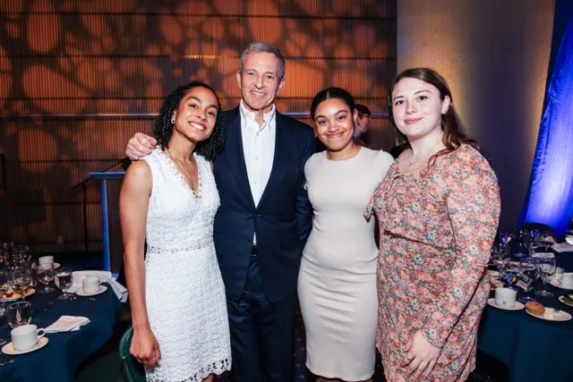 Bob Iger '73 standing with recipients of the Iger-Bay Endowed Scholarship.  