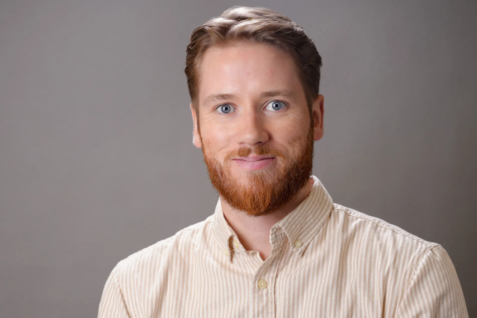 A professional headshot of Lance Warwick