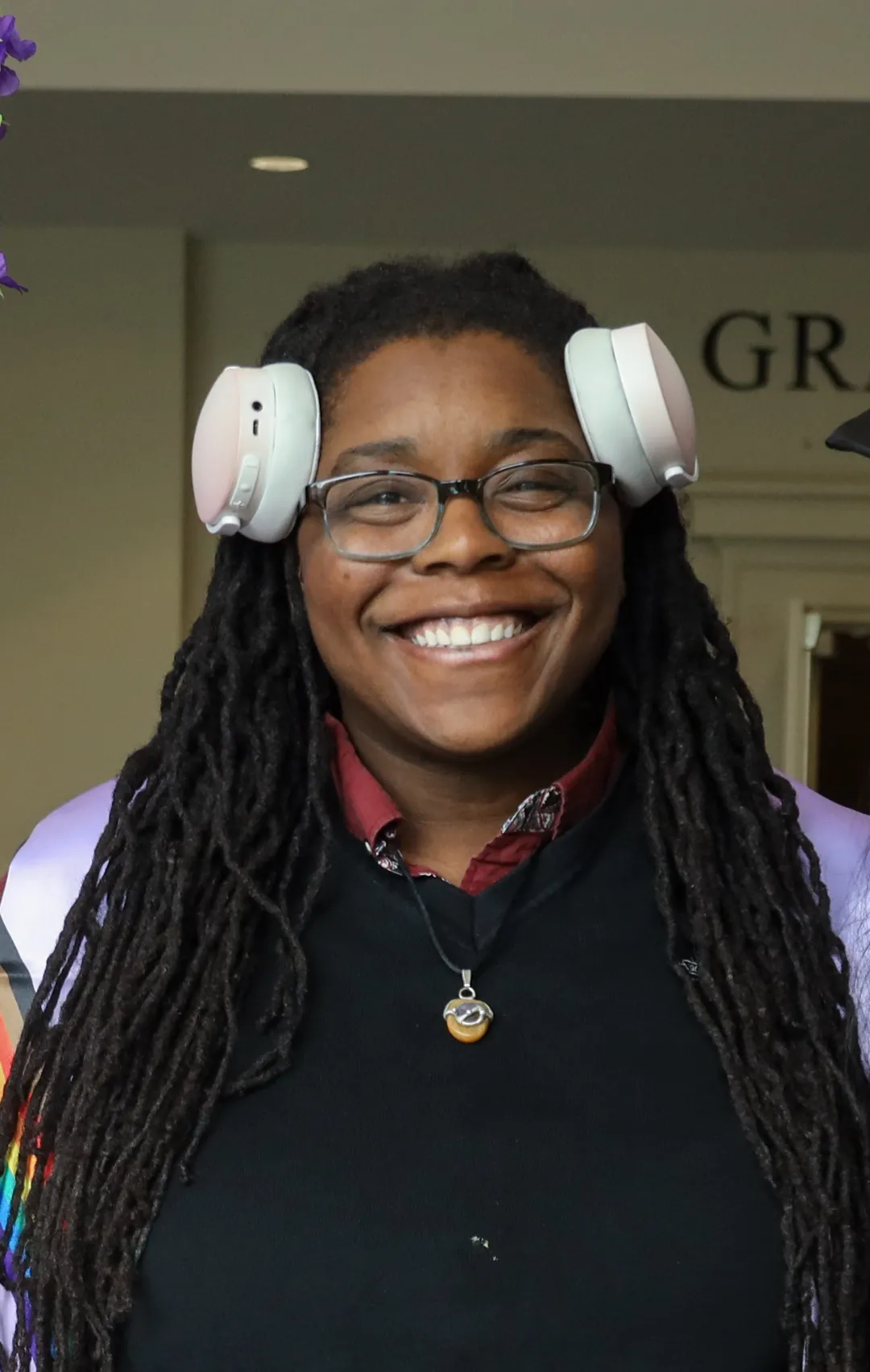 cefari, at lavender graduation, smiling at the camera