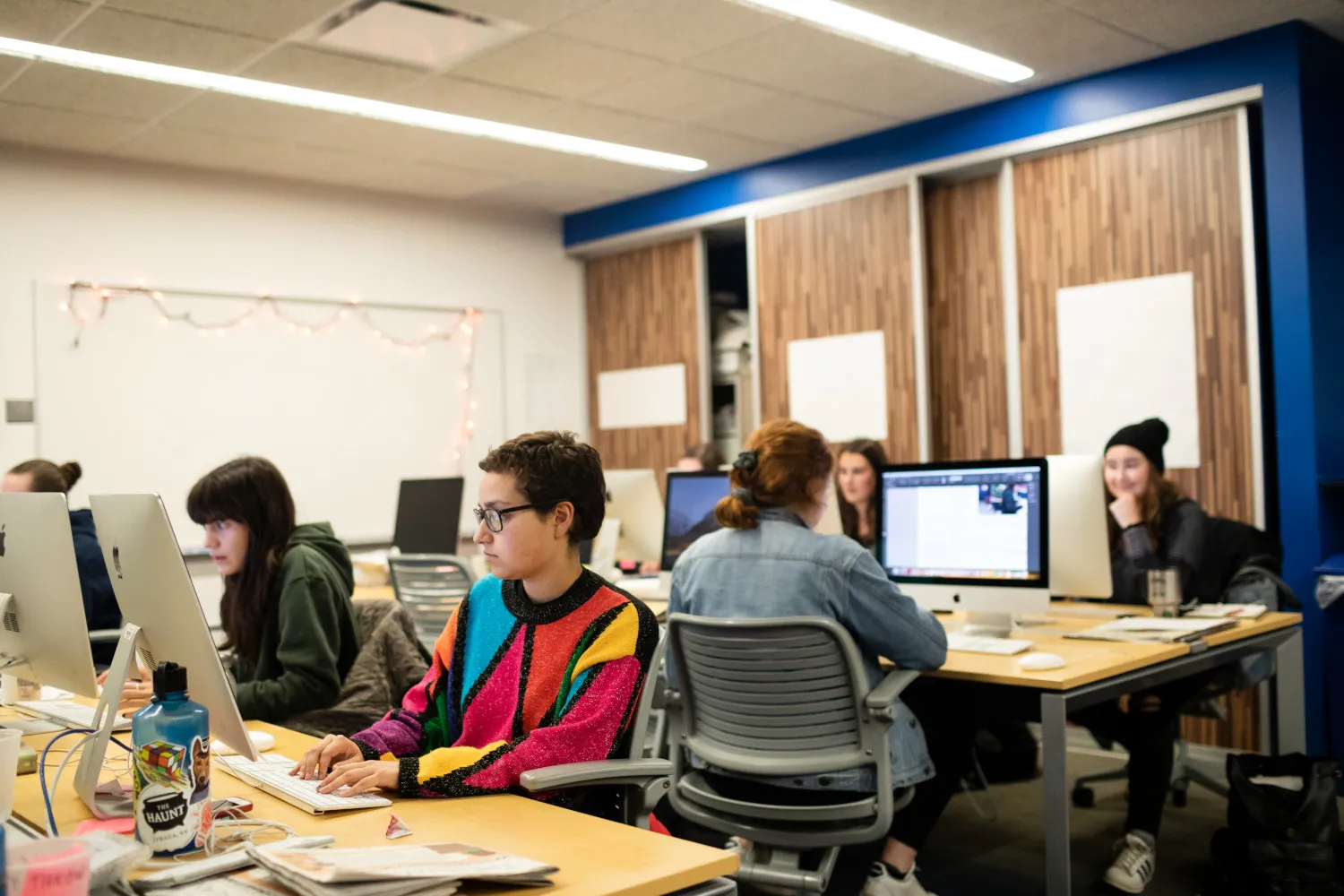 Students in front of computer terminals.