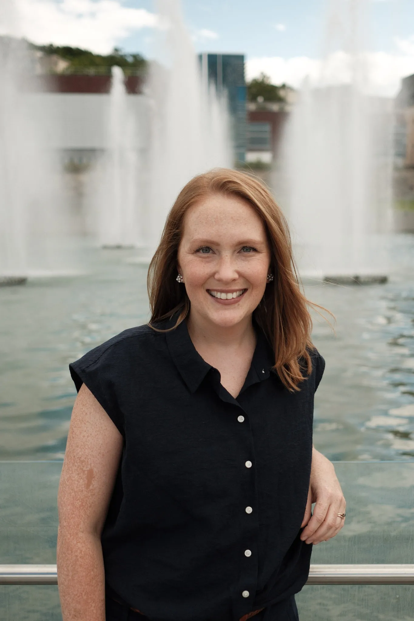 Photo of person standing by fountains