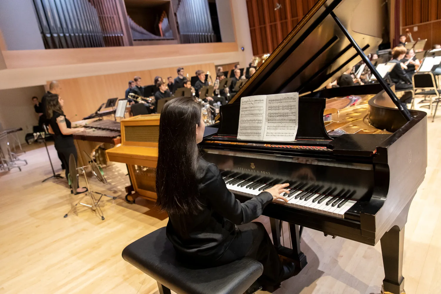 student reheasing on piano