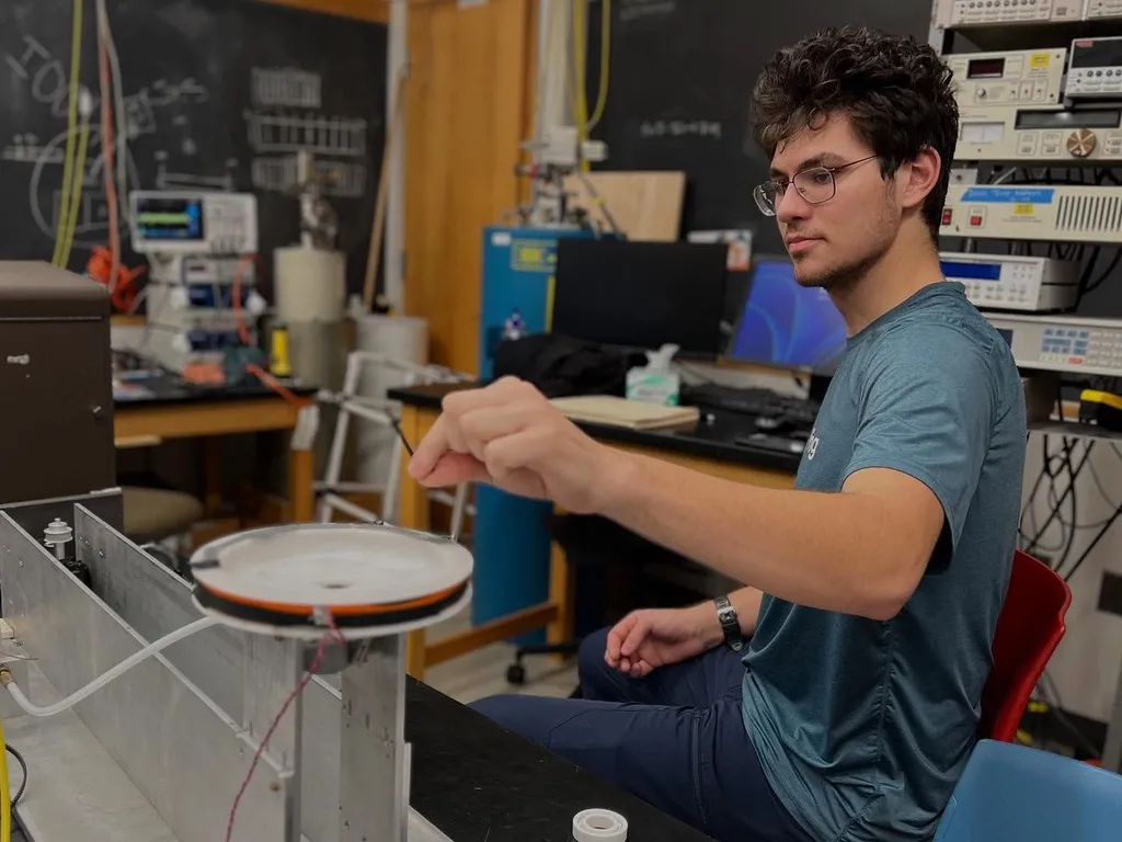 Andrew Coit '28 tests the instrumentation in Professor Matt Sullivan's lab.
