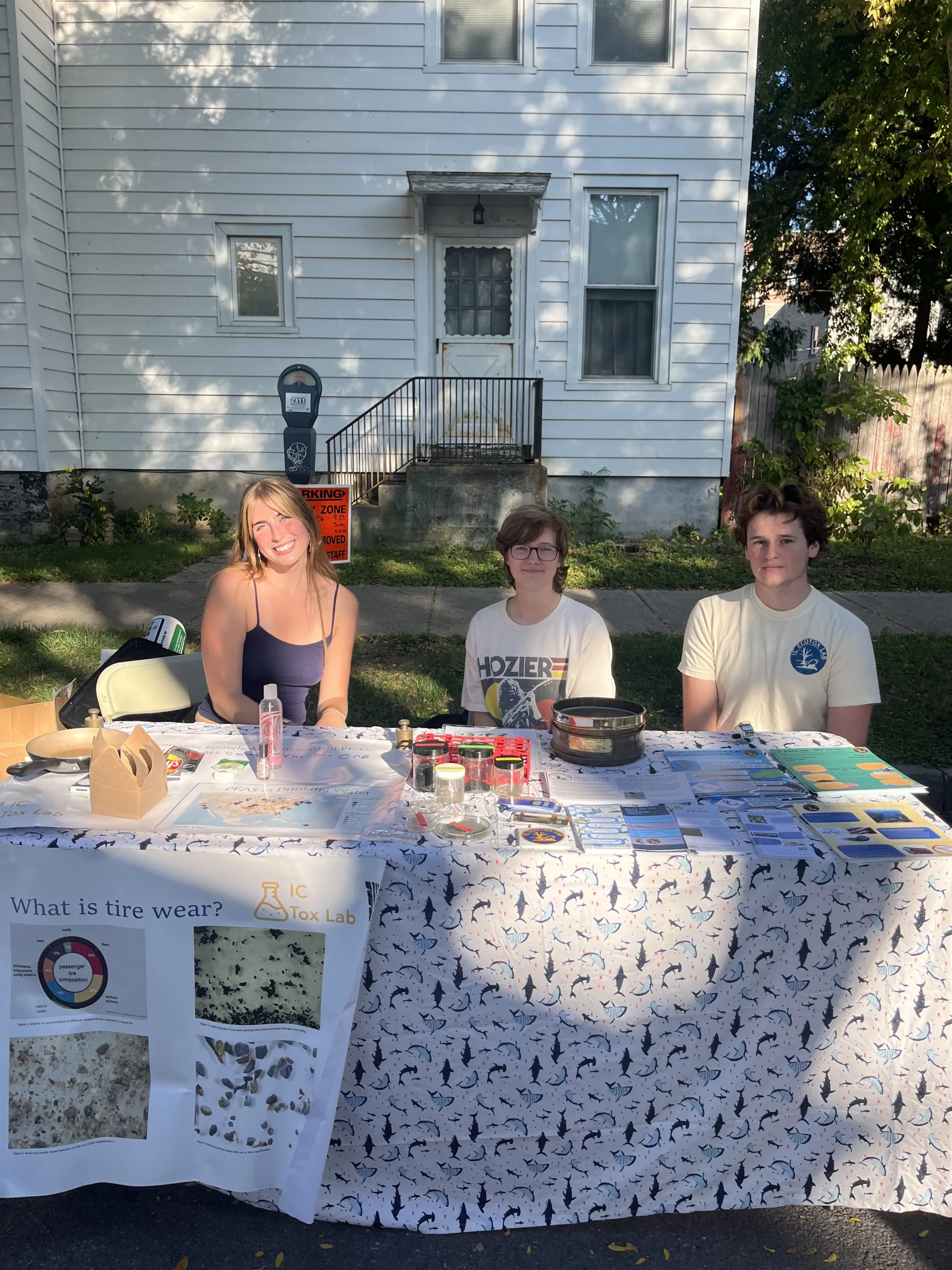 Students Sam Funk, Elliot House-Kelly, and Charlie Stearns tabling at the festival.