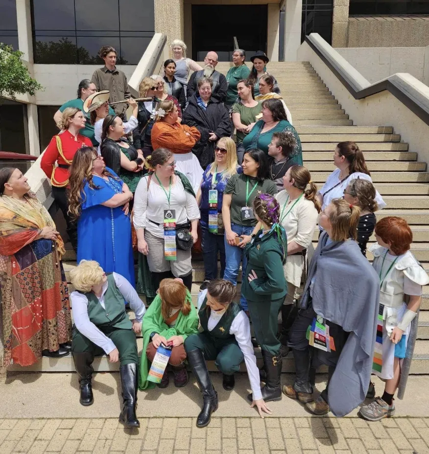 Kristen on stairs with fans