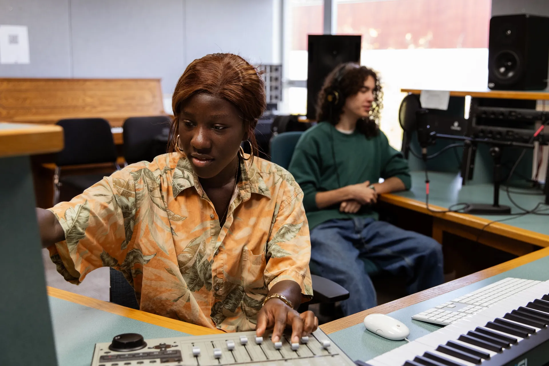 Students working in the electroacoustic music studio