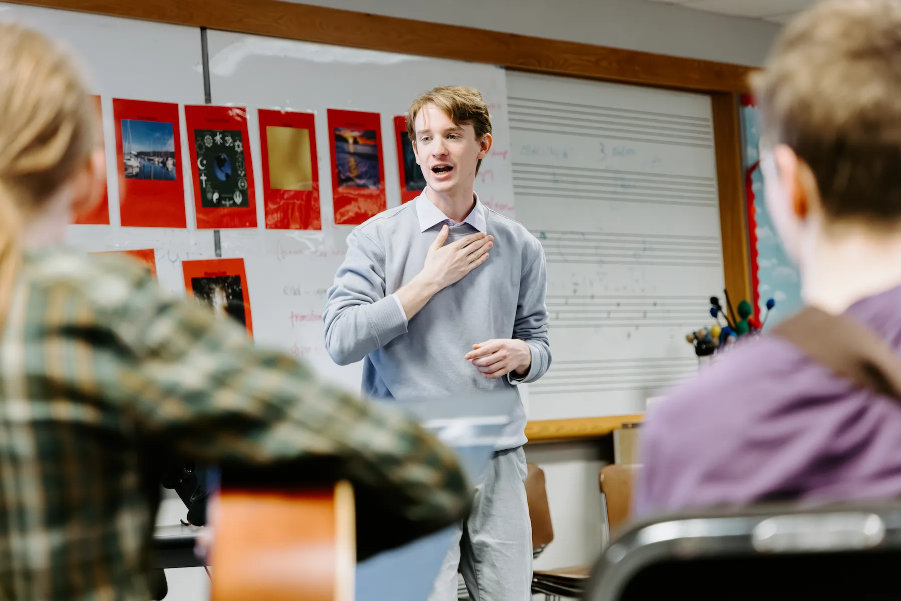 student teacher working with a classroom of students