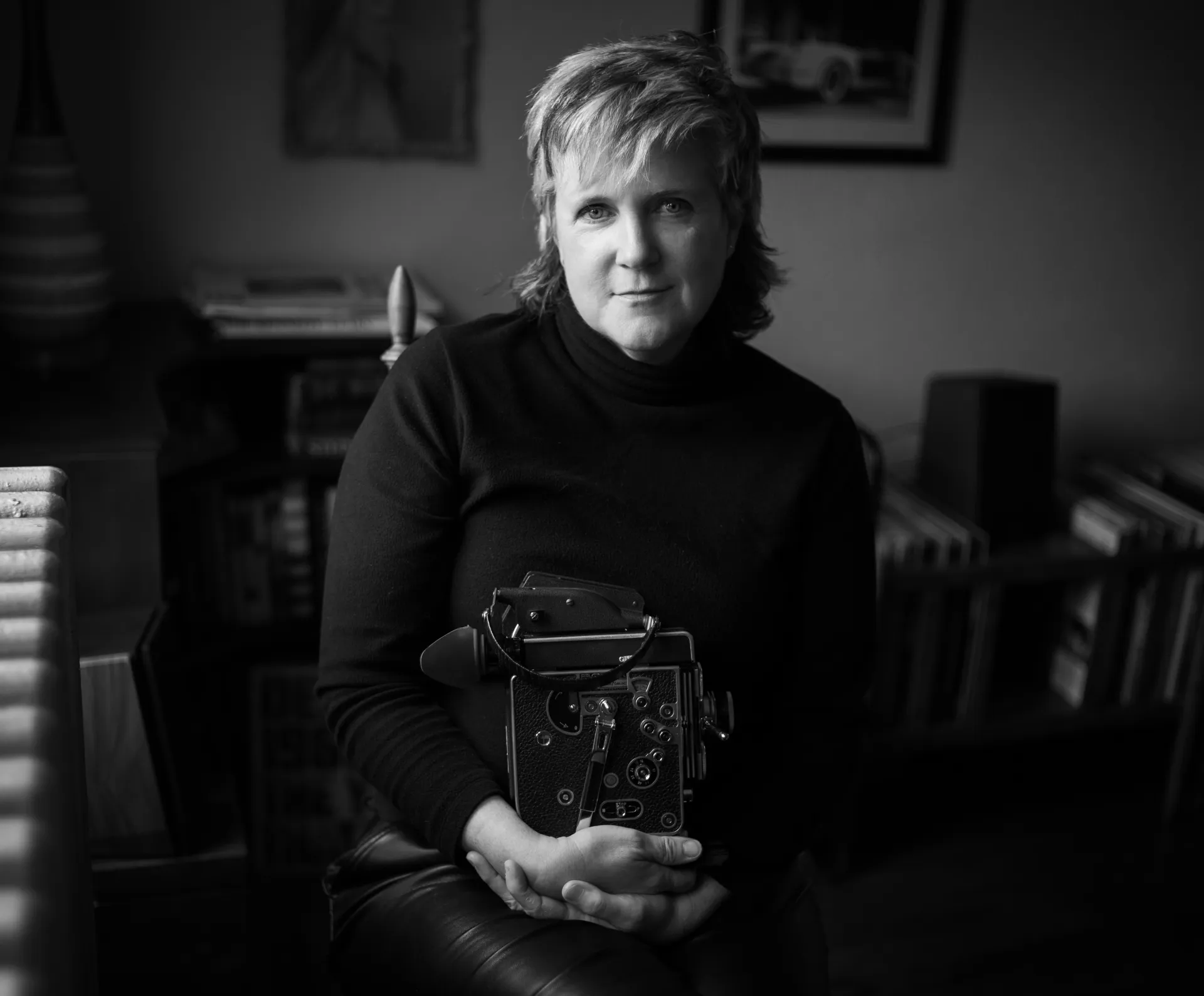 filmmaker sitting with Bolex camera