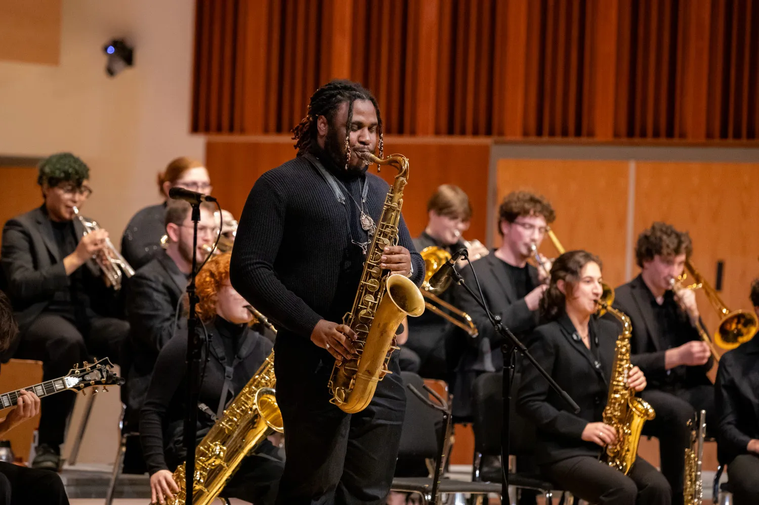 College saxophonists perform in a jazz ensemble.