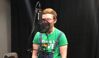 Student recording at microphone