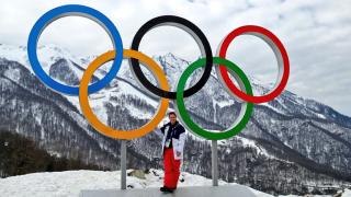 coach with olympic rings