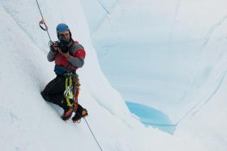 Photo of Jeff Orlowski on an iceberg