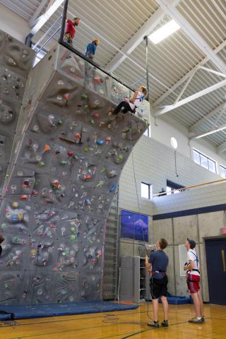 students on rock climbing wall