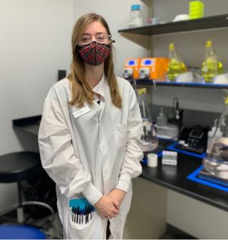 Female standing in lab