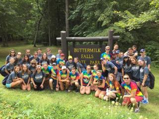 students in front of Buttermilk Falls State Park sign