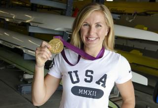 Meghan Musnicki holding her gold medal from London 2012
