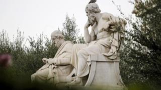 Marble statues of ancient Greek philosophers Socrates, right, and Plato, left, in front of the Athens Academy in Greece (Petros Giannakouris/AP)