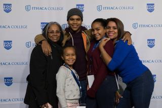 A family poses together at Family Weekend