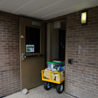 View of cart being pulled into Residential Hall