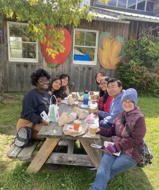 FIRST Place members having lunch at an Apple Farm