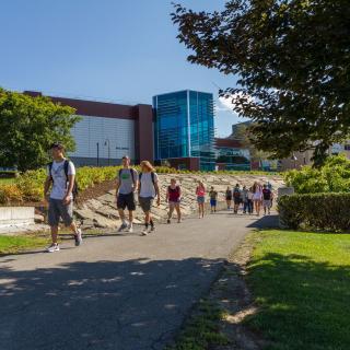 Students walking in front of Hill Center