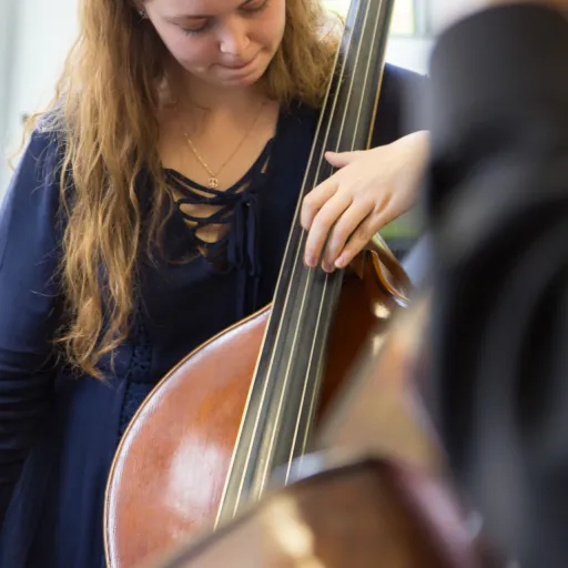 Student with a string instrument