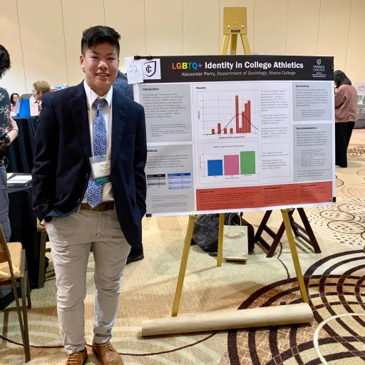 Person standing next to display