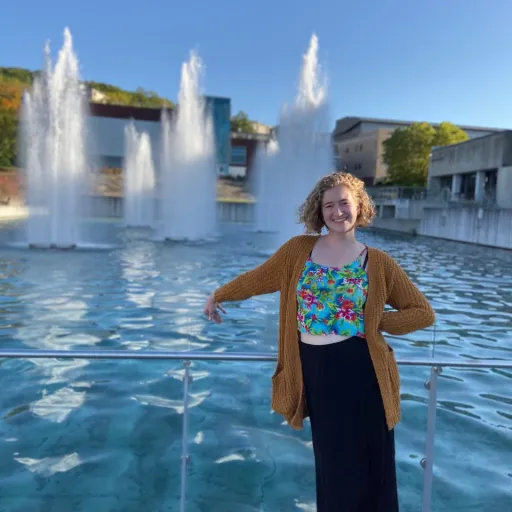 Person with short, curly blonde hair by IC Fountains.