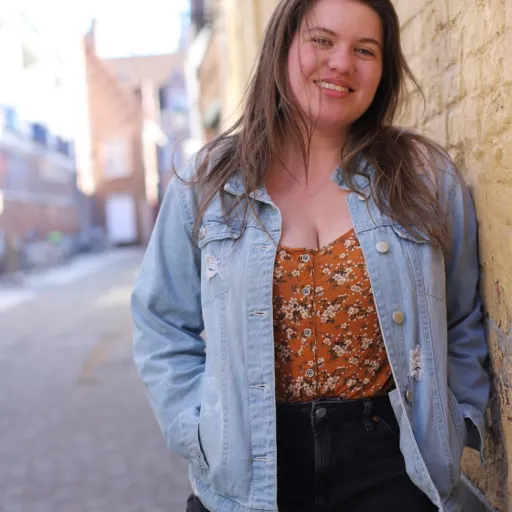 Headshot of young woman with long brown hair