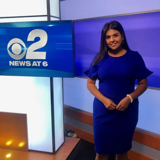 Journalist standing in newsroom