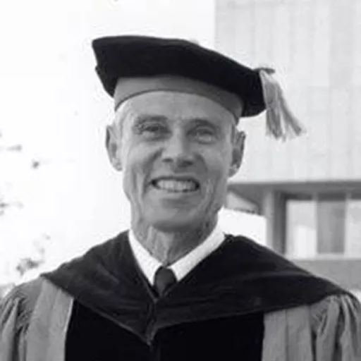 Black and white portrait in academic cap and gown.