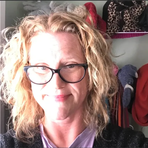 Jennifer smiling with sun shining on her face