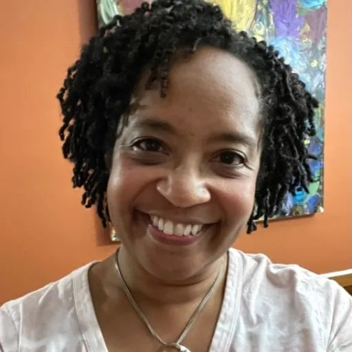 Stephanie smiling in office