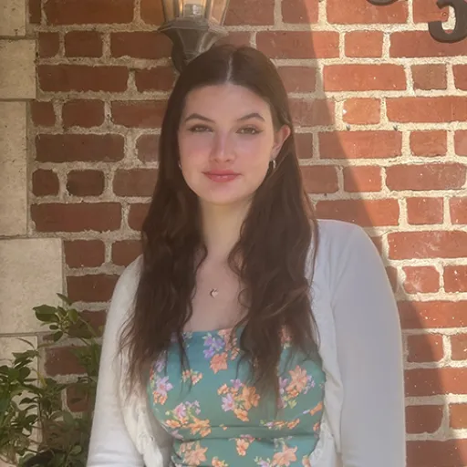 Woman standing in front of a house